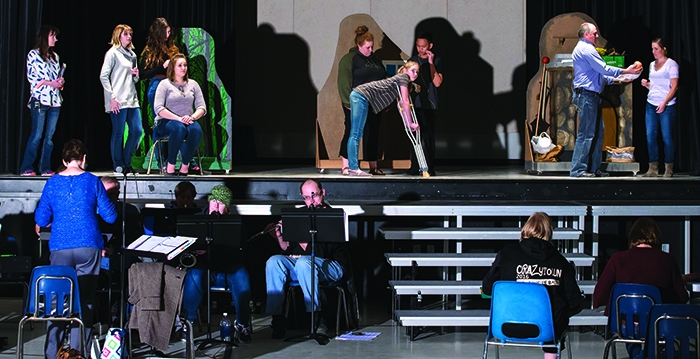 The actors, above, and the band below, practicing at the Conexus Convention Centre for Into the Woods.